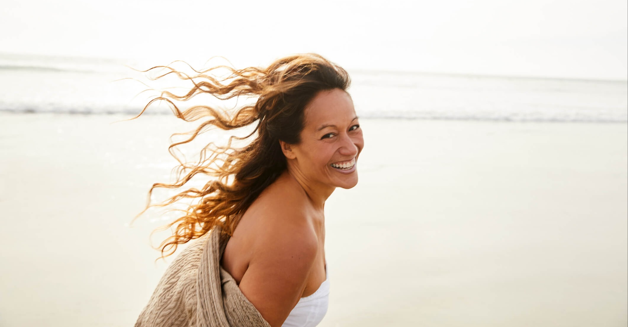 Smiling woman at the beach